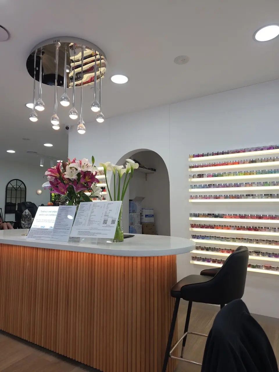 The MONSTERA reception desk, chandelier and wall of colours
